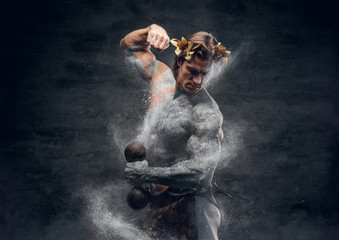 Ancient Greek male sportsmen holds dumbbell.