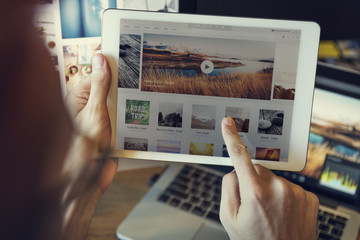 Using Tablet Searching Browsing Travel Website Concept