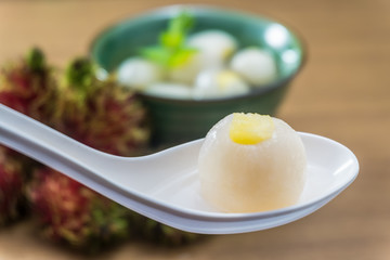 Peeled rambutan stuffed with pineapple in syrup.