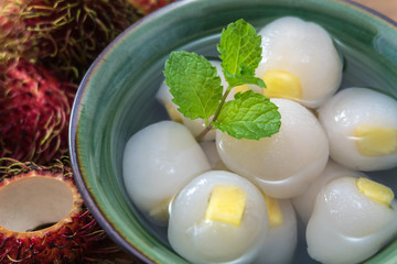 Peeled rambutan stuffed with pineapple in syrup.
