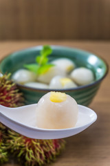 Peeled rambutan stuffed with pineapple in syrup.