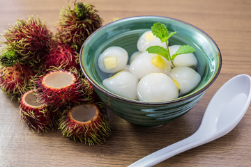 Peeled rambutan stuffed with pineapple in syrup.