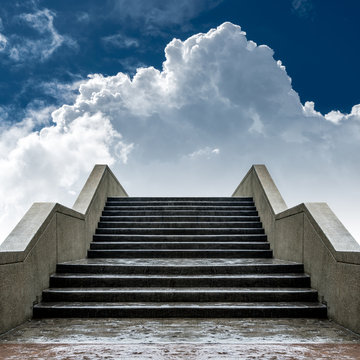 Concrete staircase with white cloud and blue sky background