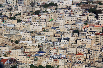 Fototapeta na wymiar Homes on a hillside in Israel as seen from near the old city of Jerusalem.