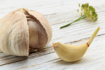 Garlic on a white wooden board