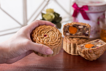 Moon cake in woman hands