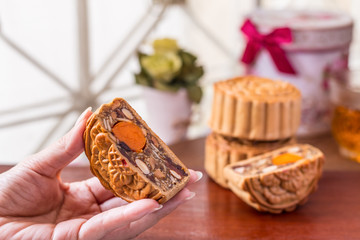 Moon cake in woman hands