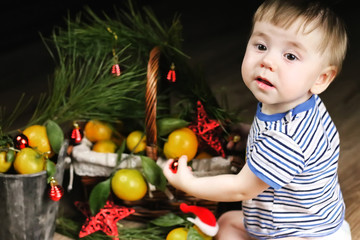 Fototapeta na wymiar sweet little girl in dress with christmas basket