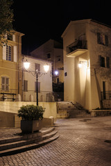 Fototapeta na wymiar Narrow old street at night in Saint-Tropez, France.