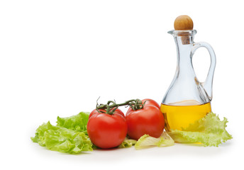 Tomato, lettuce salad and jug of vegetable oil isolated