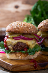 Burger with  gherkins, red onion and lettuce