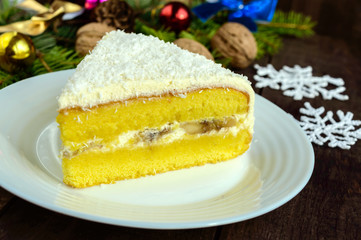 Gentle sponge cake with creamy banana layer, sprinkle coconut on top. Option festive dessert. 