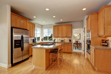 Wooden kitchen room interior design with steel appliances