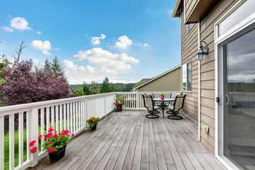 Wooden walkout deck with beautiful landscape view.