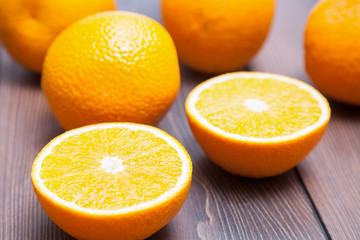 Ripe oranges on wooden background