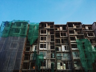Building construction site against blue sky