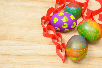 Fototapeta na wymiar Easter eggs with ribbon heart