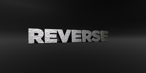 REVERSE - hammered metal finish text on black studio - 3D rendered royalty free stock photo. This image can be used for an online website banner ad or a print postcard.
