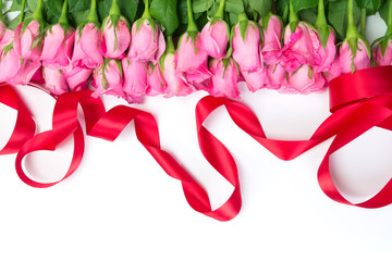 border of Beautiful fresh sweet pink rose and red ribbon 