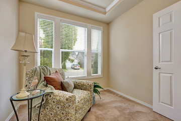 Small sitting room interior with an armchair