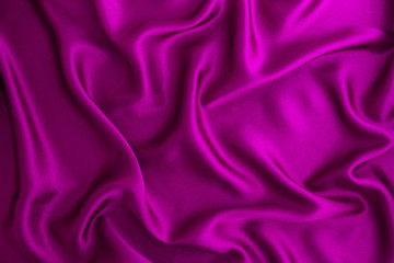 Close up wave purple silk or satin fabric background