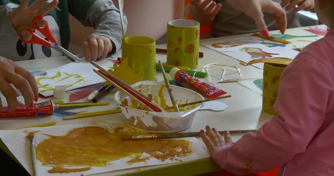 Paints, Crayons and Children's Hands.