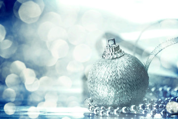 the silver christmas ball decorations with abstract silver bokeh