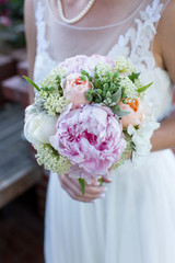 Bride Holding a Bouquet of Flowers