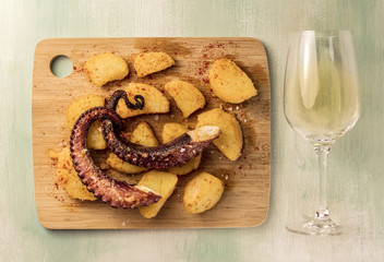 Octopus with potatoes and white wine, traditional Spanish meal