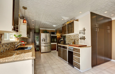 Kitchen room in brown tones with storage combination