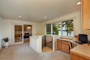 Small hallway interior with home office area in the corner