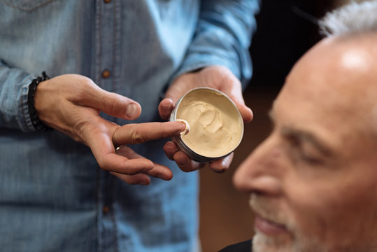 Close Up Of Hairstylist Holding Hair Gel