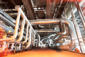 different size and shaped pipes and valves at a power plant