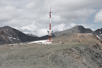 Cellular tower on top of the mountain. The height  3000 meters. Altai, Russia.