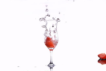 tomateos spashing into wine glass