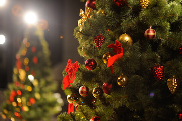 Obraz na płótnie Canvas Christmas background with Christmas tree, Christmas ornaments and a big red bow