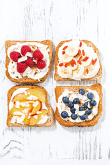 sweet toast with different toppings, top view, vertical