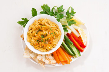 traditional sauce hummus with fresh vegetables and pita bread