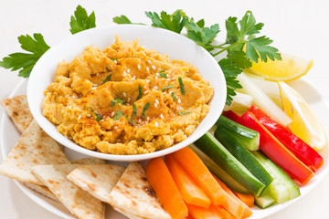 traditional sauce hummus with fresh vegetables, pita bread