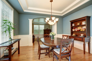 American classic dining room interior with green walls.