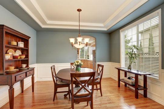 American classic dining room interior with green walls.