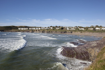 Obraz premium View across the popular tourist beach at polzeath, Cornwall, UK