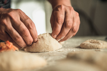 homemade cakes of the dough in the women's hands