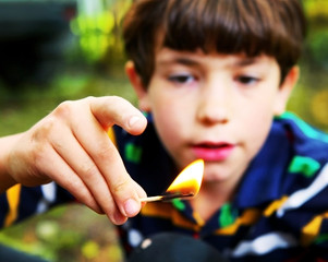 naughty boy play with fire hold match © ulianna19970