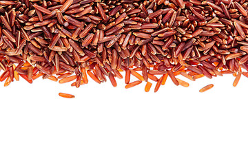 Border of red rice close-up  on white background. Isolated. Decorative frame of wild brown unpolished rice.