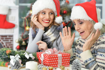 Two women in santa hats 