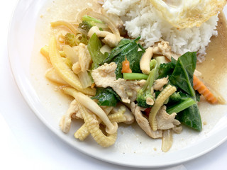 stir-fried mixed vegetables with rice in white dish on white background.