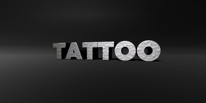 TATTOO - hammered metal finish text on black studio - 3D rendered royalty free stock photo. This image can be used for an online website banner ad or a print postcard.
