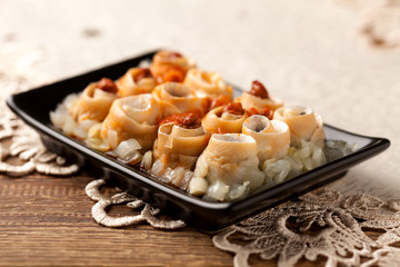 Rolled herring in olive, served with onions. Perfect for vodka.