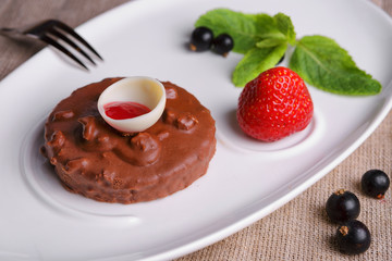 Chocolate cake with strawberries and currants